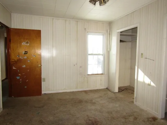 a view of an empty room with a window
