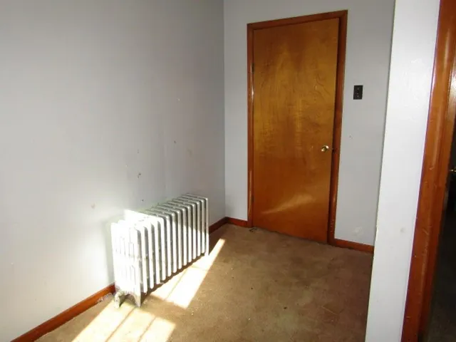 a view of a hallway with a door