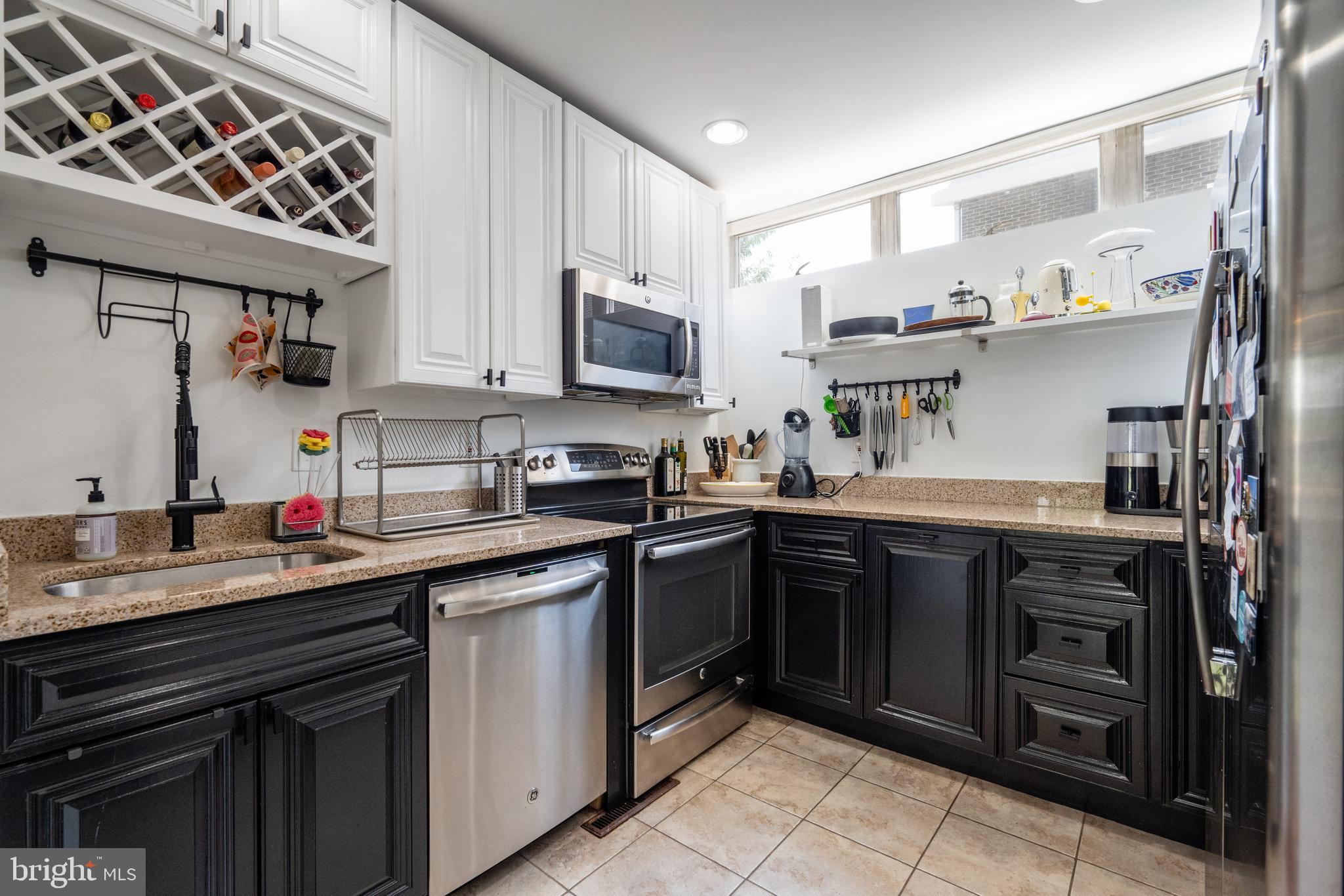 352 N Street Southwest Washington, DC 20024 - Photo 13 of 57 a kitchen with stainless steel appliances granite countertop a sink and cabinets