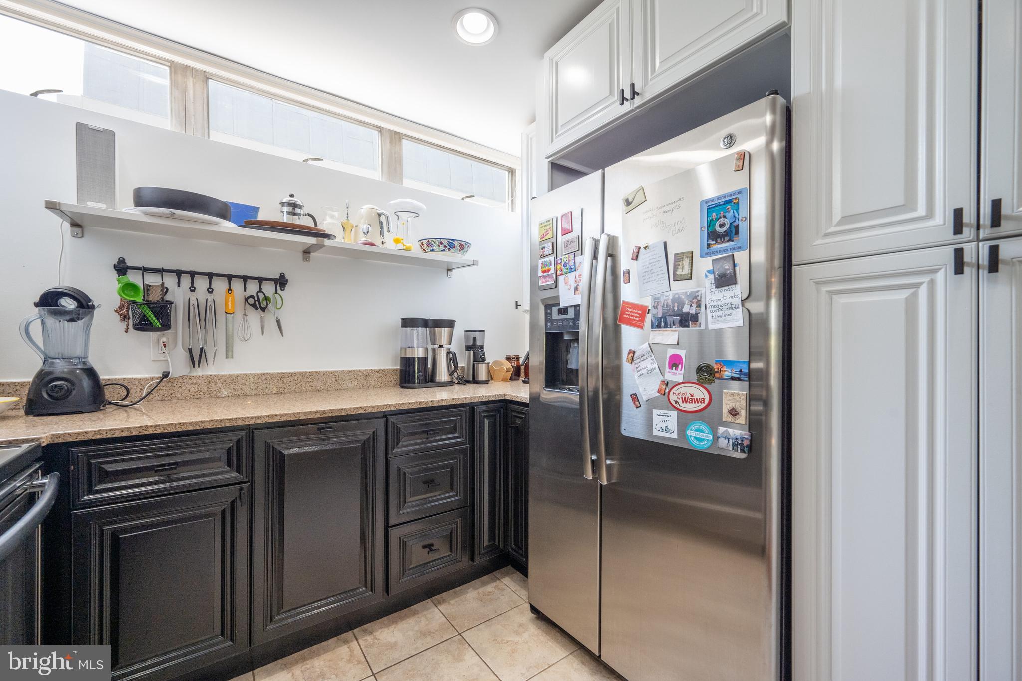 352 N Street Southwest Washington, DC 20024 - Photo 14 of 57 a kitchen with stainless steel appliances granite countertop a refrigerator and a sink