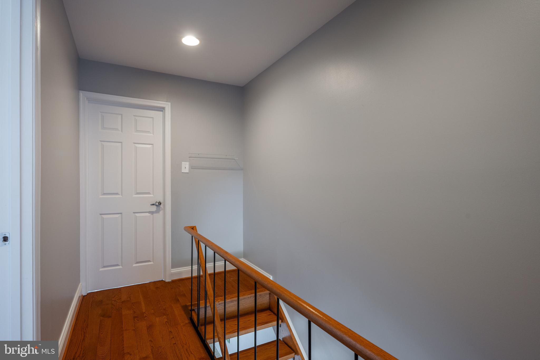 352 N Street Southwest Washington, DC 20024 - Photo 16 of 57 a view of a hallway with wooden floor and staircase