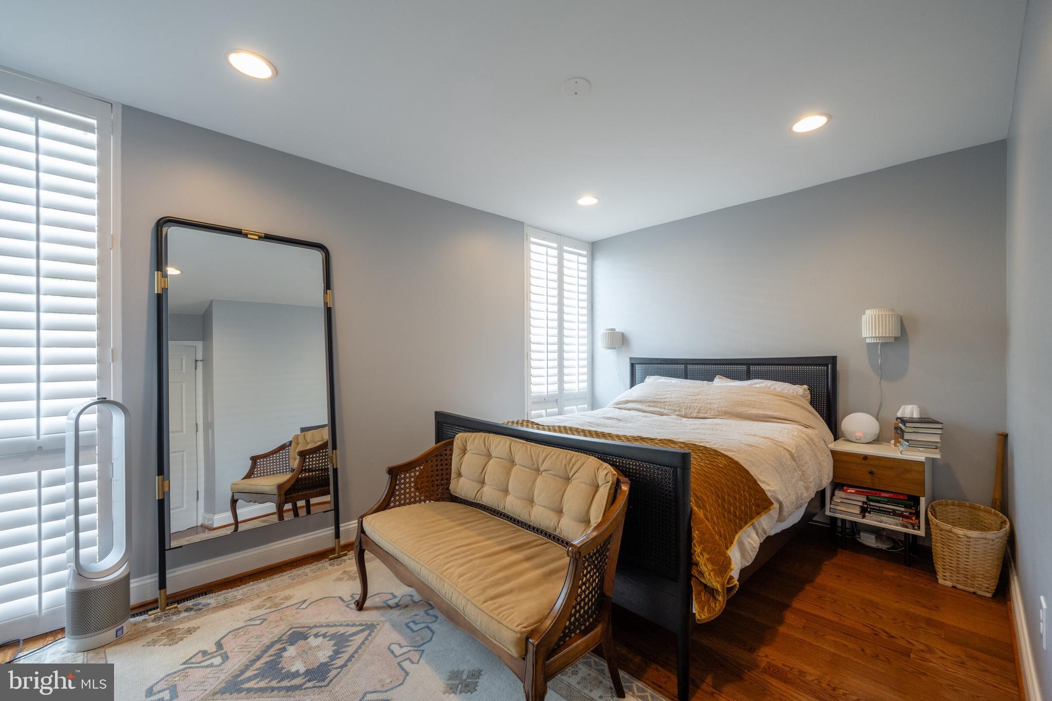 352 N Street Southwest Washington, DC 20024 - Photo 17 of 57 a bedroom with a bed and wooden floor