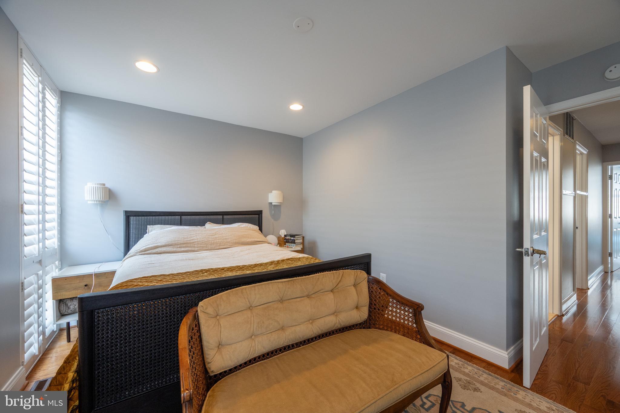 352 N Street Southwest Washington, DC 20024 - Photo 18 of 57 a bedroom with a bed and a mirror