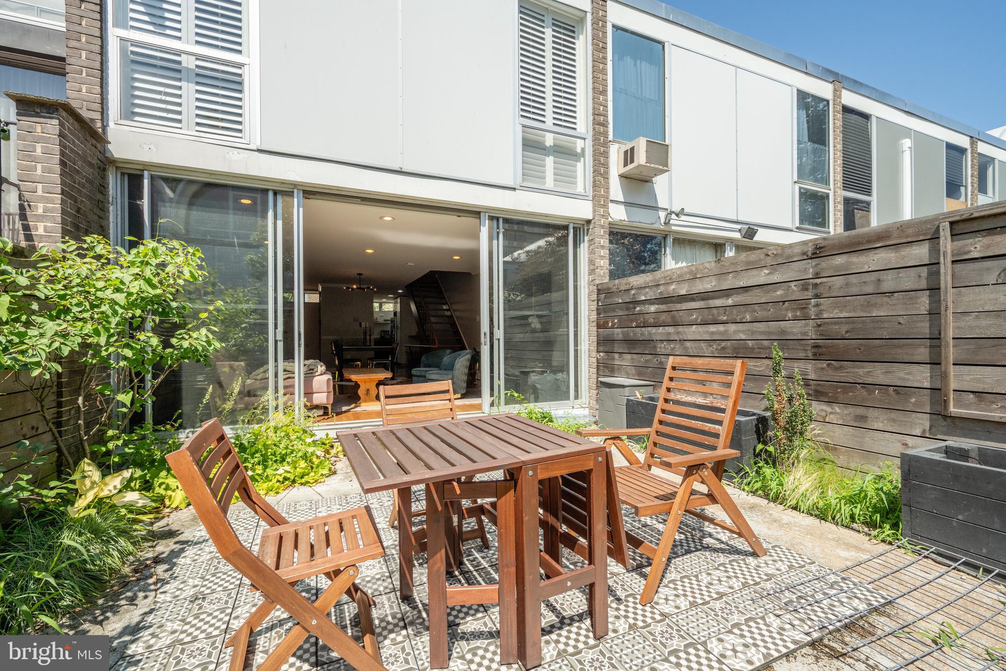 352 N Street Southwest Washington, DC 20024 - Photo 7 of 57 a view of a patio with table and chairs and potted plants