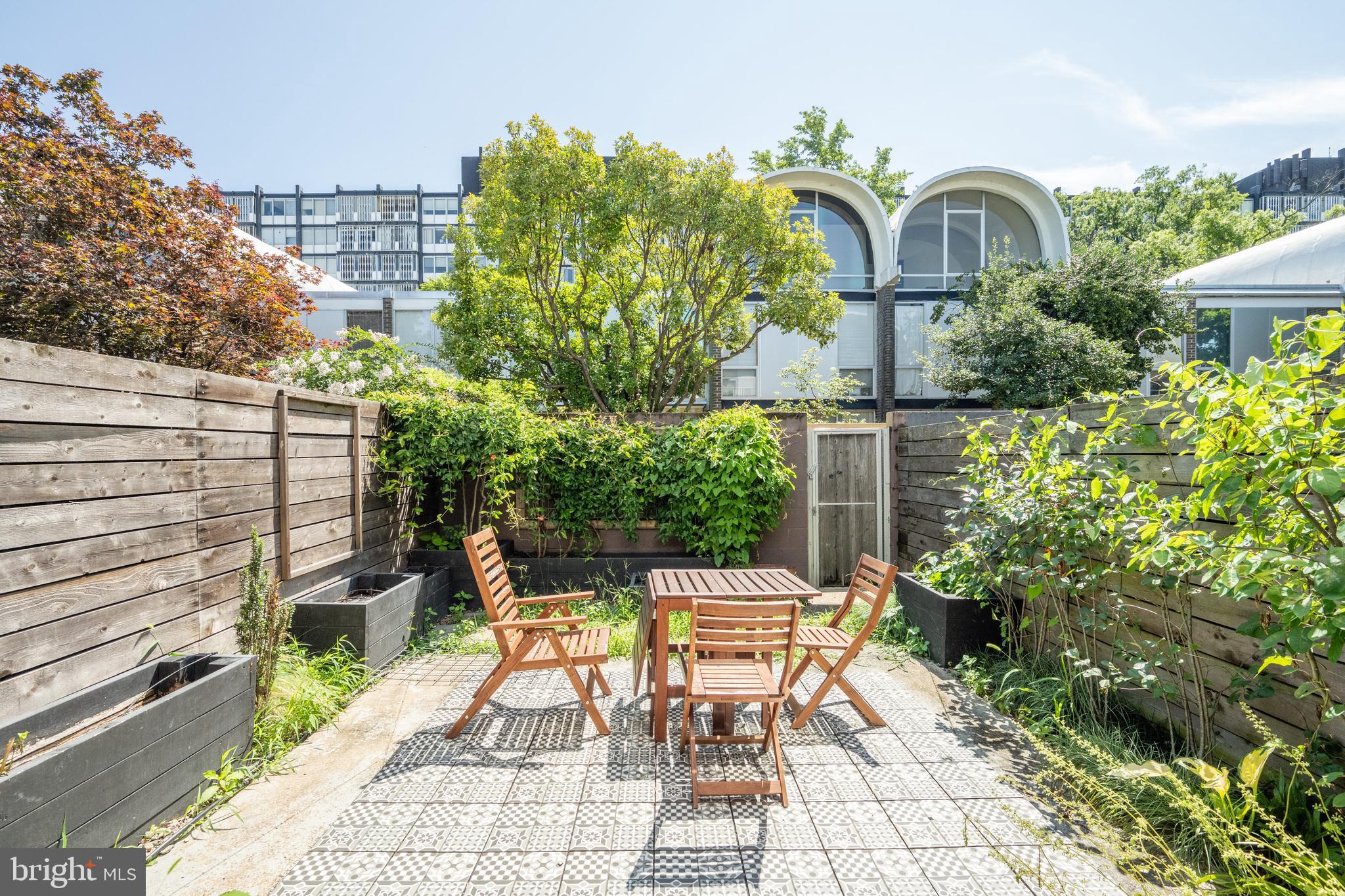 352 N Street Southwest Washington, DC 20024 - Photo 8 of 57 a view of a chairs and table in a backyard