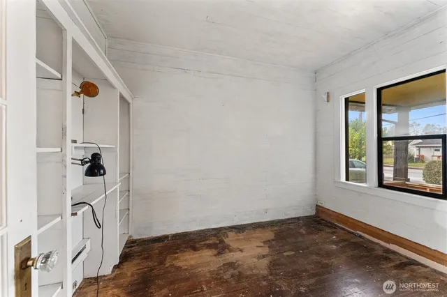 a view of an empty room with a window