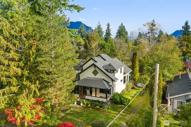 an aerial view of a house with a yard