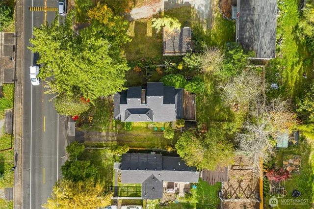 an aerial view of a house with a yard