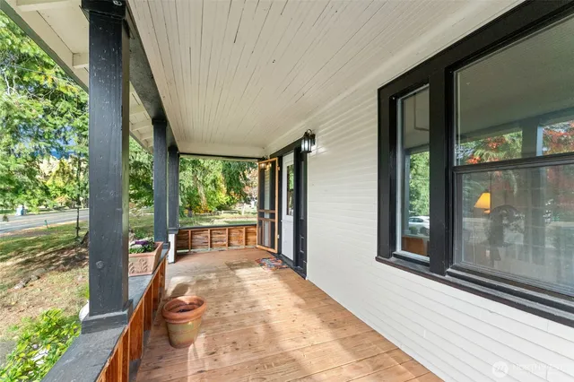 a view of a porch with a floor to ceiling window