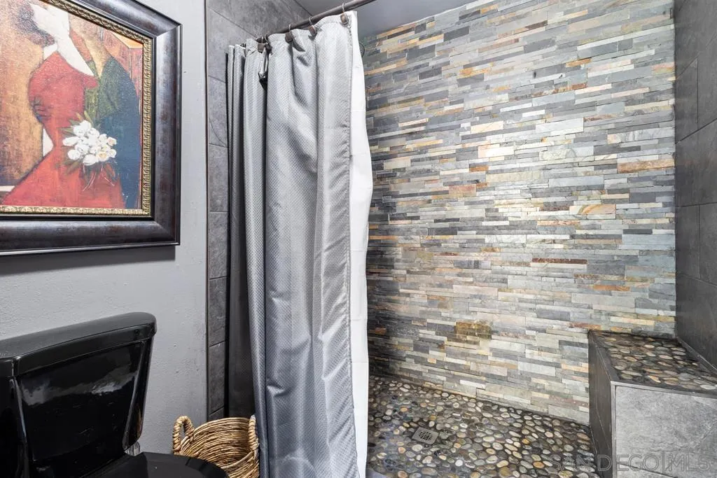 13492 Jamul Drive Jamul, CA 91935 - Photo 13 of 24 a bathroom with a shower and a sink