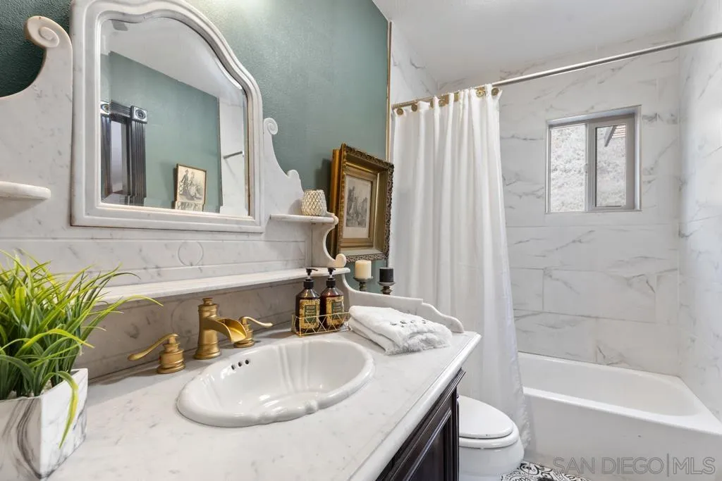 13492 Jamul Drive Jamul, CA 91935 - Photo 15 of 24 a bathroom with a sink toilet and shower