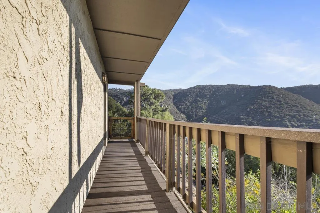 13492 Jamul Drive Jamul, CA 91935 - Photo 21 of 24 a view of a balcony with wooden floor and fence