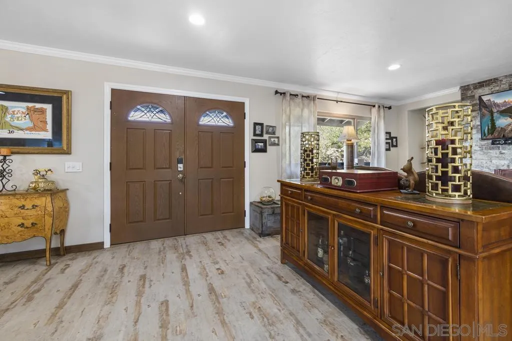 13492 Jamul Drive Jamul, CA 91935 - Photo 3 of 24 a spacious bathroom with a granite countertop sink a mirror and a bathtub