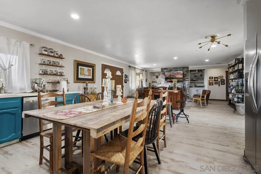 13492 Jamul Drive Jamul, CA 91935 - Photo 8 of 24 a view of a dining area with furniture and wooden floor
