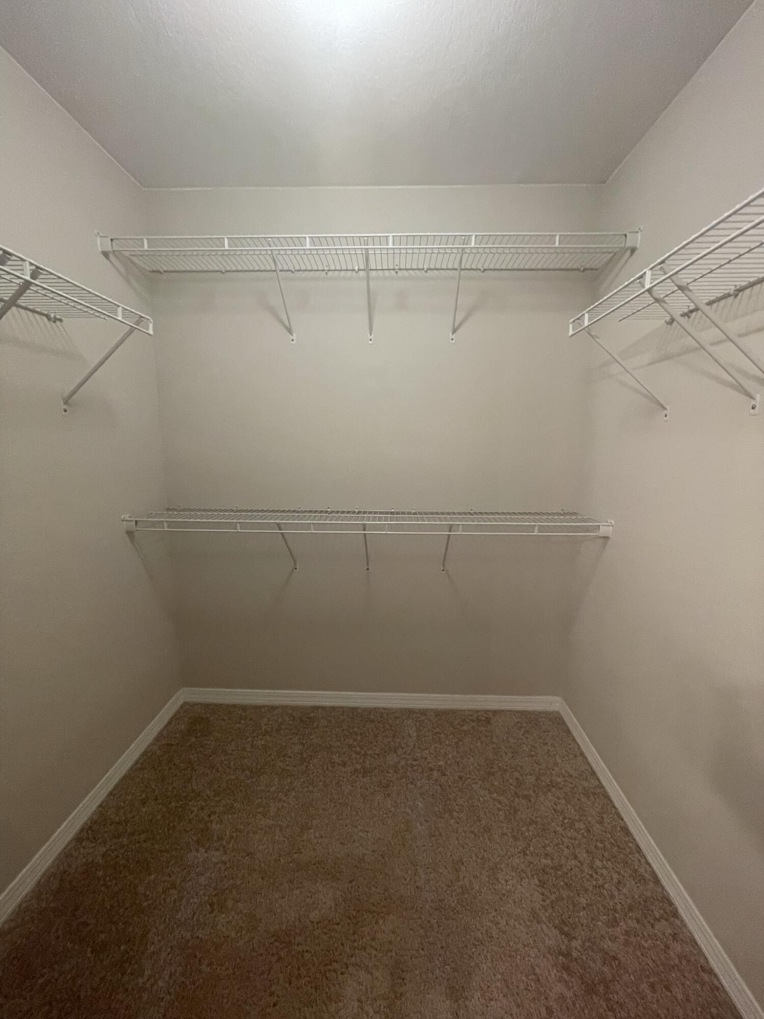 4270 Painter Branch Road Crestview, FL 32539 - Photo 11 of 15 a view of a room with racks on the wall