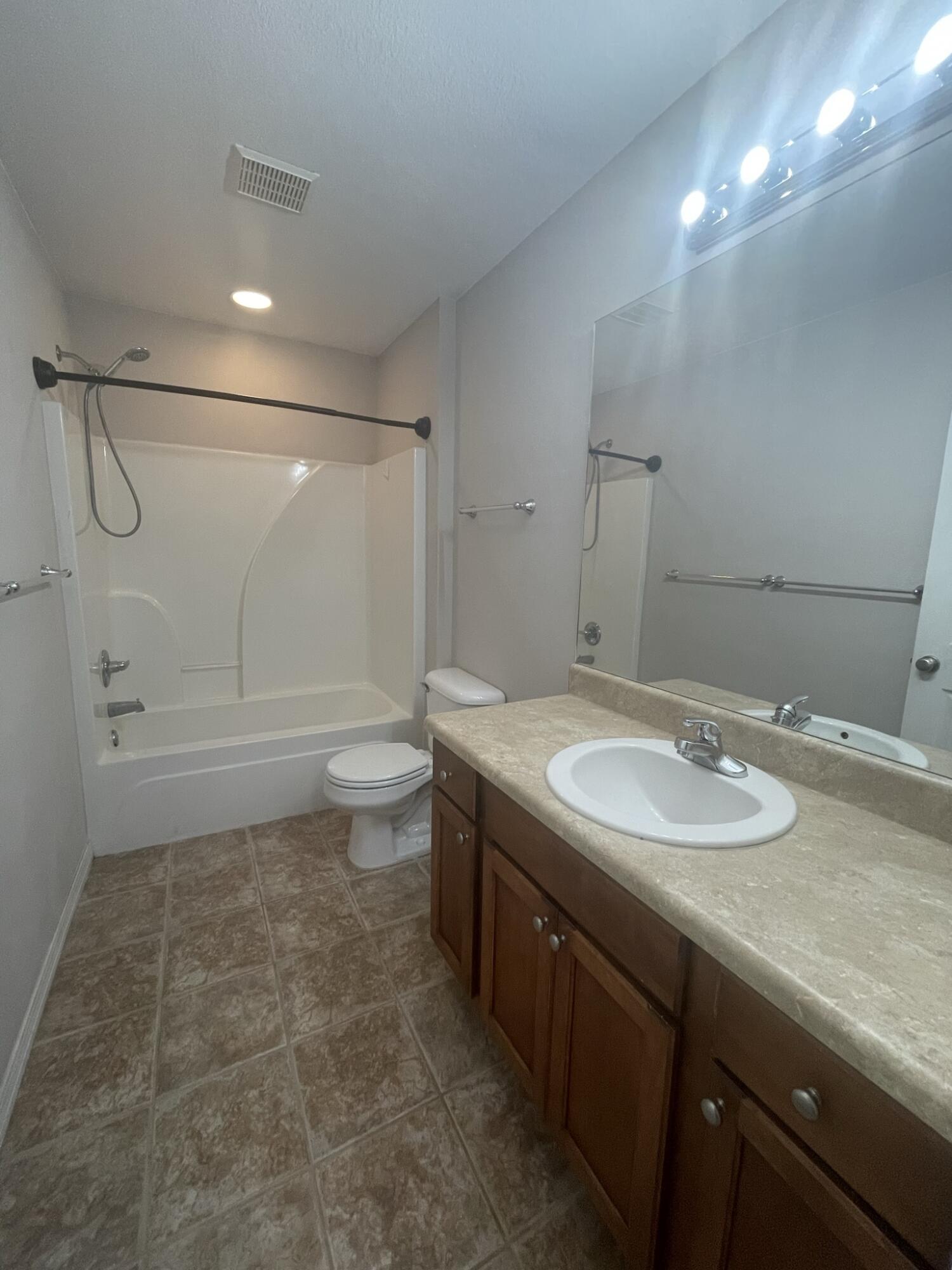 4270 Painter Branch Road Crestview, FL 32539 - Photo 13 of 15 a bathroom with a sink a toilet and shower