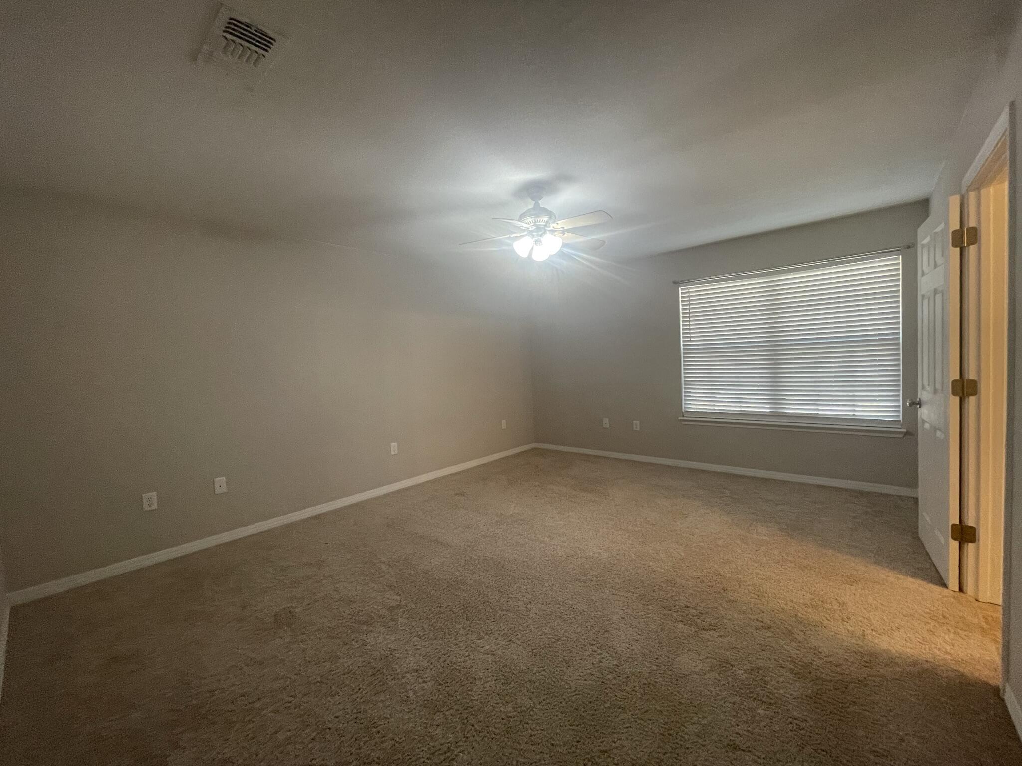 4270 Painter Branch Road Crestview, FL 32539 - Photo 7 of 15 a view of an empty room with a window
