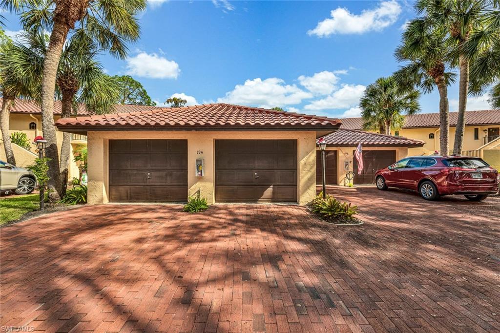 194 Albi Road, Unit 202 Naples, FL 34112 - Photo 3 of 50 Garage is first door on the left.