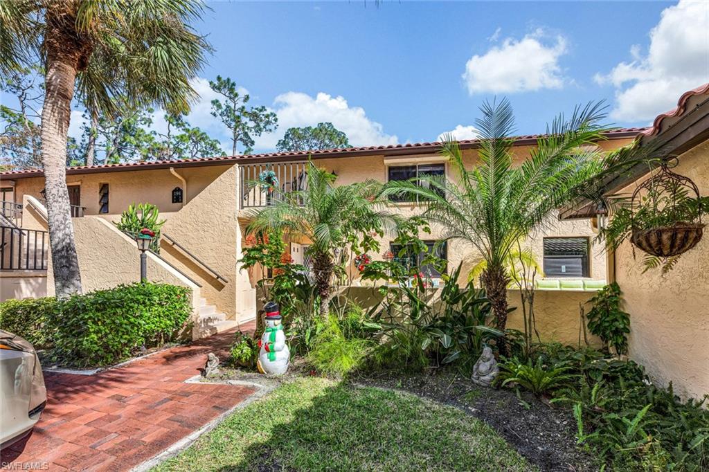 194 Albi Road, Unit 202 Naples, FL 34112 - Photo 4 of 50 Beautifully Landscaped exterior.