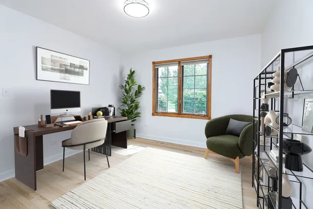a workspace with furniture hardwood and a window