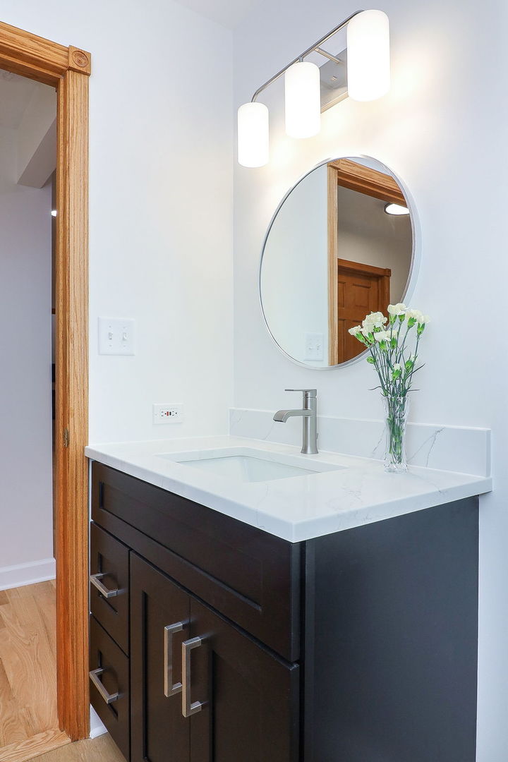 1249 Cronin Court Lemont, IL 60439 - Photo 19 of 40 a bathroom with a sink and a mirror