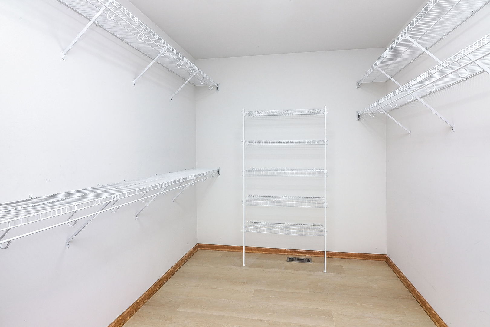 1249 Cronin Court Lemont, IL 60439 - Photo 22 of 40 a view of walk in closet with empty racks