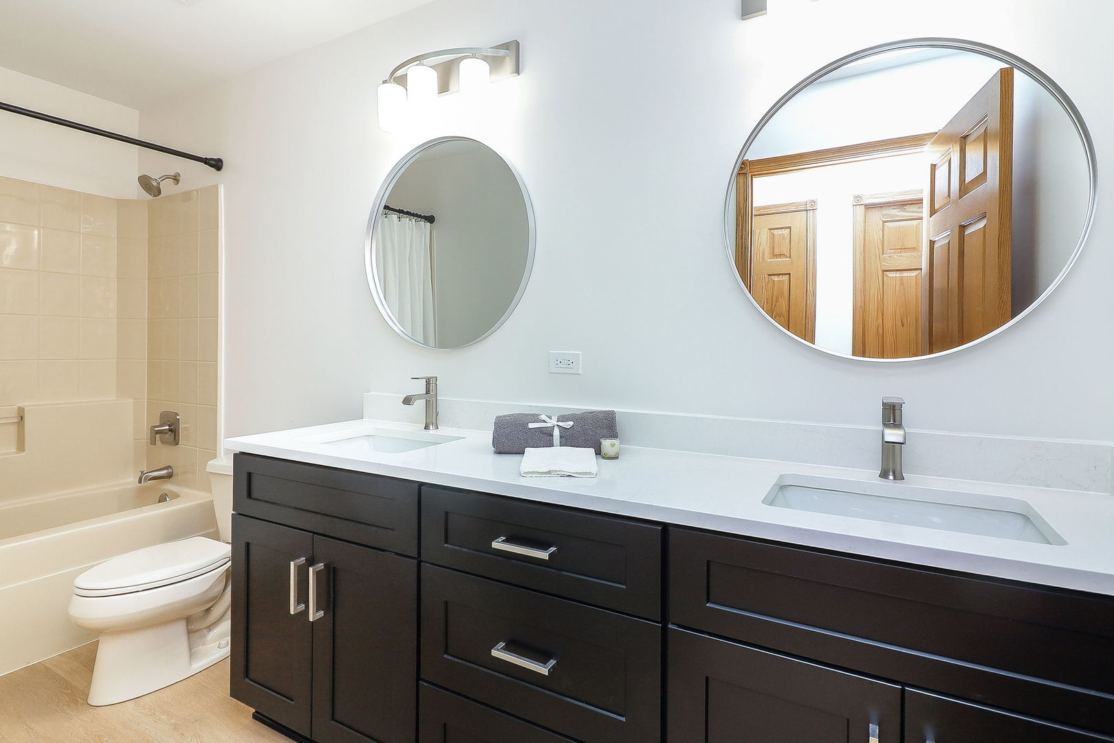 1249 Cronin Court Lemont, IL 60439 - Photo 30 of 40 a bathroom with a toilet a double vanity sink and a mirror