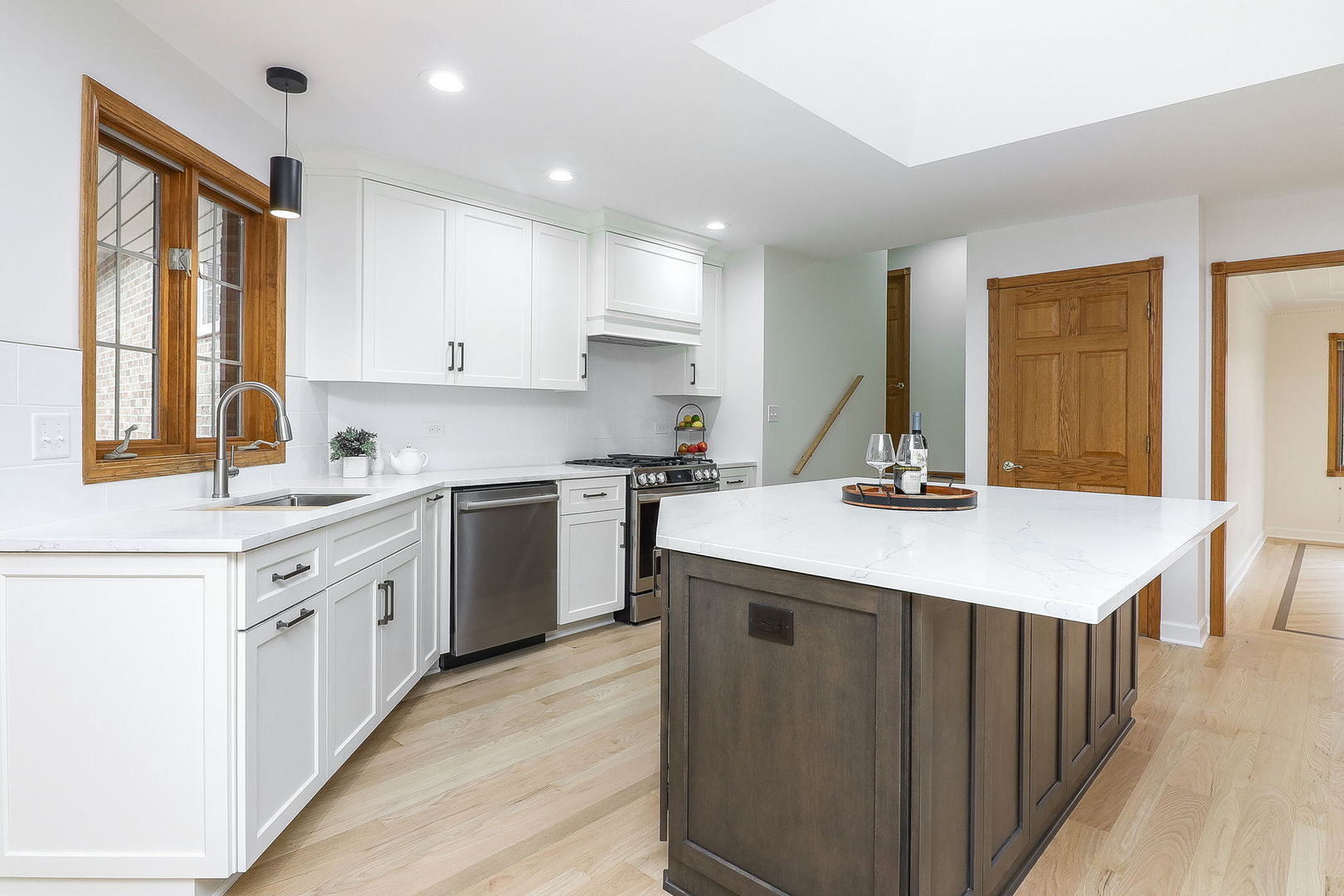 1249 Cronin Court Lemont, IL 60439 - Photo 3 of 40 a kitchen with a sink stove and cabinets