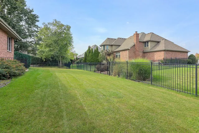 a view of a house with a yard and plants