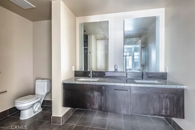 a bathroom with a toilet and shower