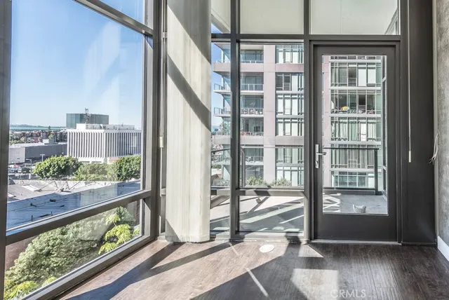a view of an entryway with wooden floor and door