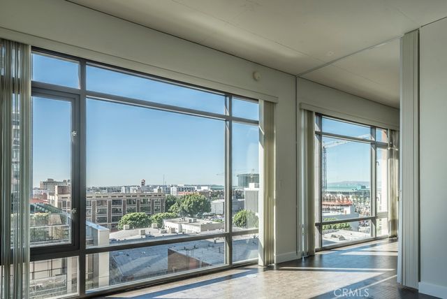 a view of a room with wooden floor