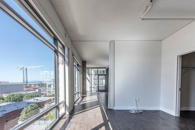 a bathroom with a granite countertop toilet a sink and a mirror
