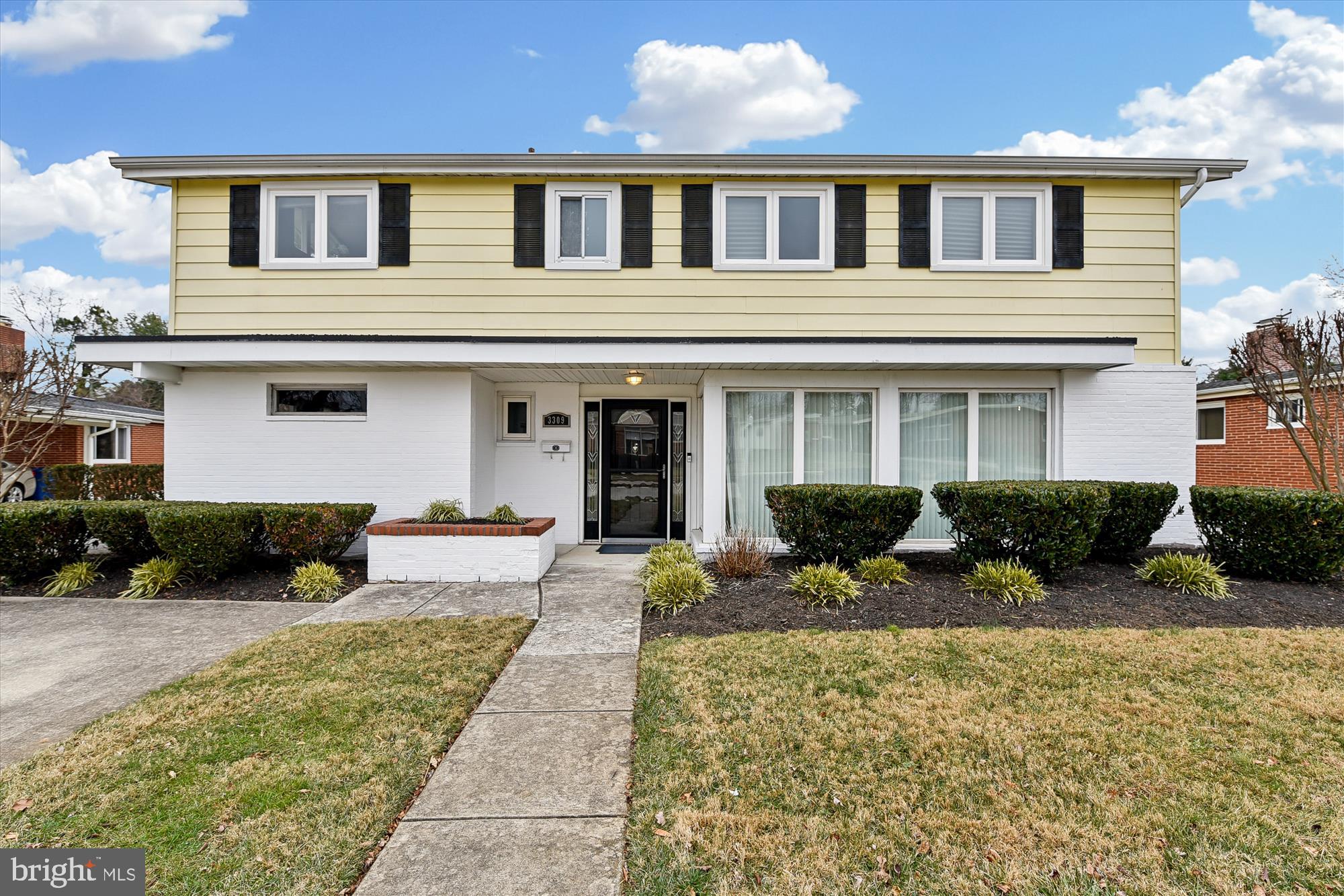 a front view of a house with a yard