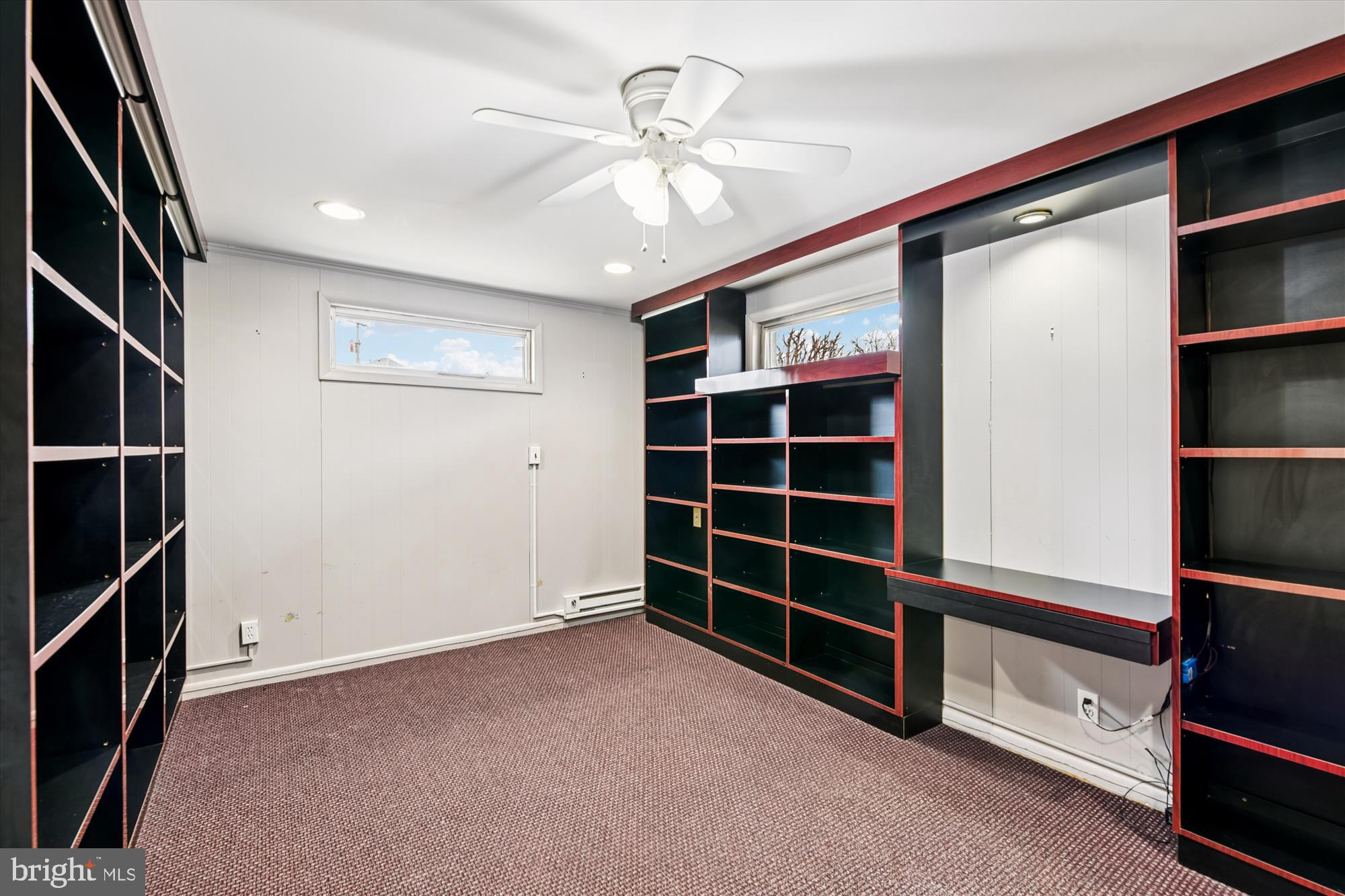 3309 Olympia Avenue Baltimore, MD 21215 - Photo 11 of 41 a view of an empty room with a fireplace and a window