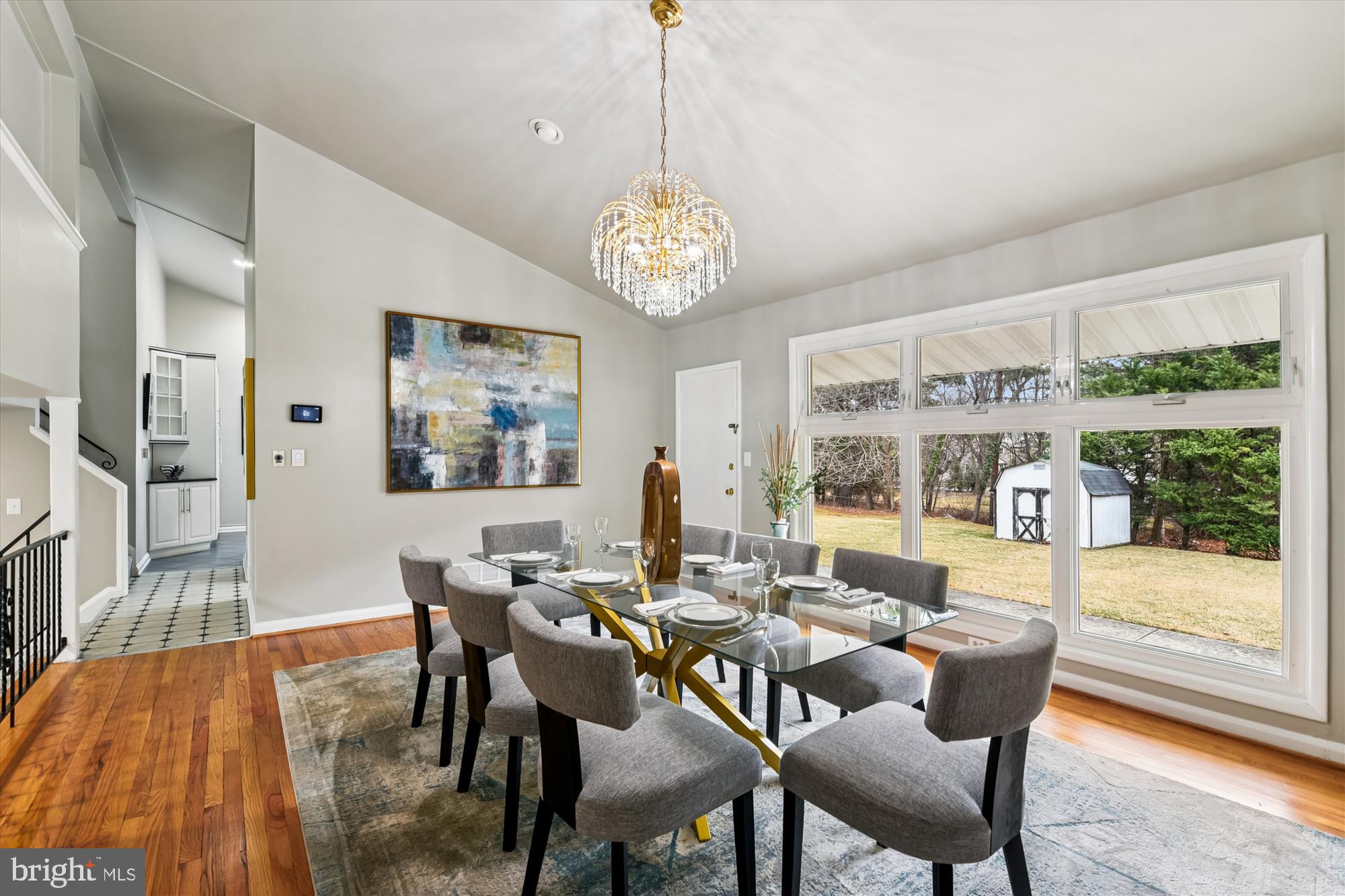 3309 Olympia Avenue Baltimore, MD 21215 - Photo 19 of 41 a view of a dining room with furniture wooden floor and a chandelier