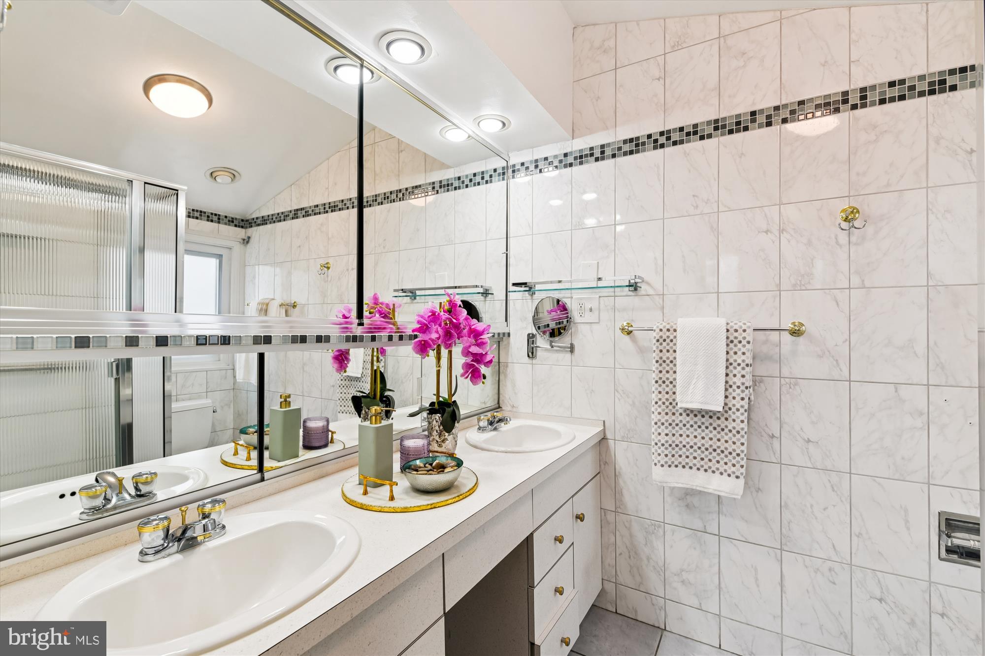 3309 Olympia Avenue Baltimore, MD 21215 - Photo 26 of 41 a bathroom with a sink vanity and a mirror