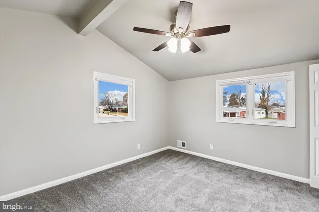 a view of a hallway with a large window