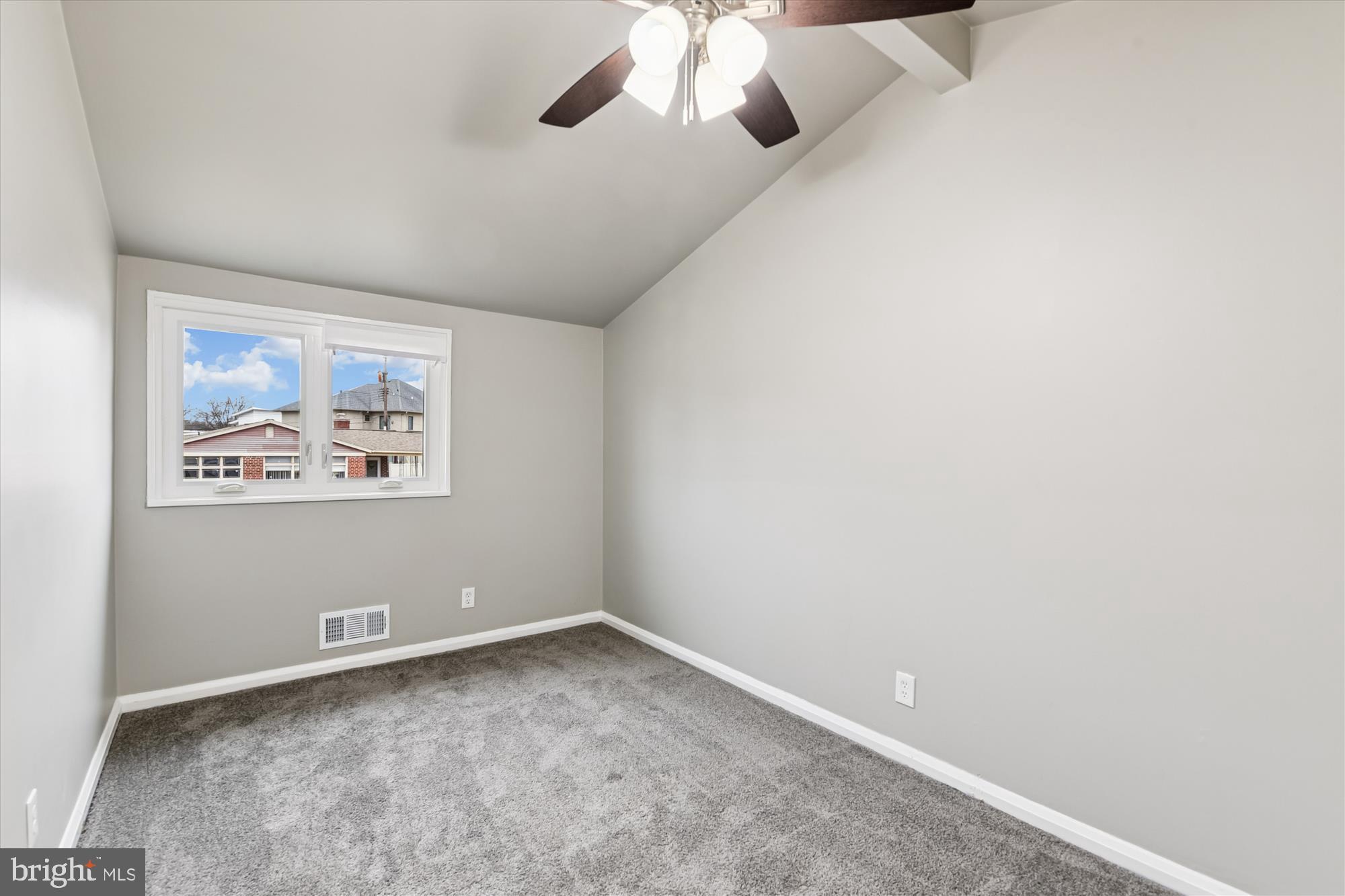 3309 Olympia Avenue Baltimore, MD 21215 - Photo 31 of 41 an empty room with a window and a fan