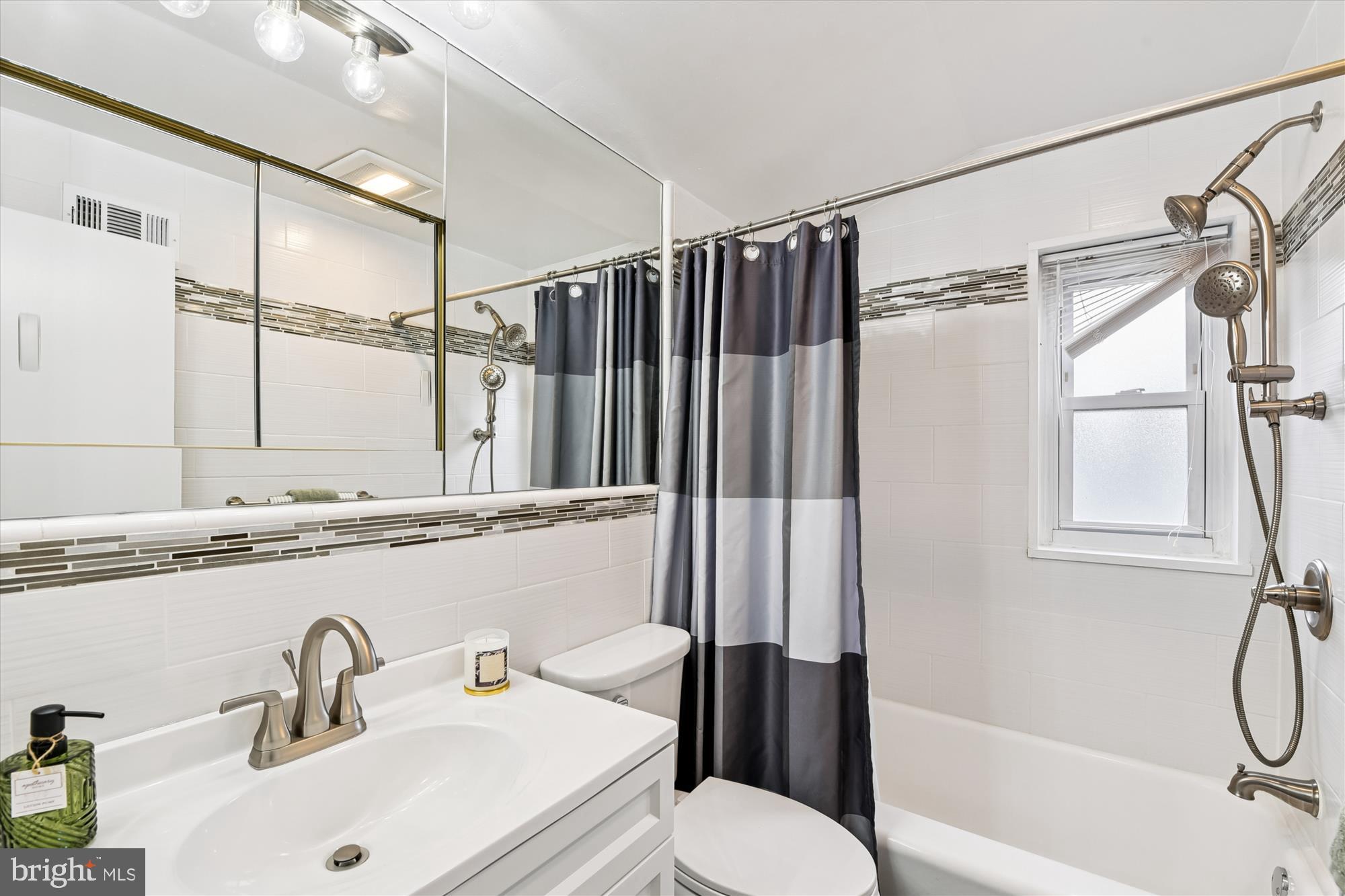 3309 Olympia Avenue Baltimore, MD 21215 - Photo 32 of 41 a bathroom with a sink toilet and shower