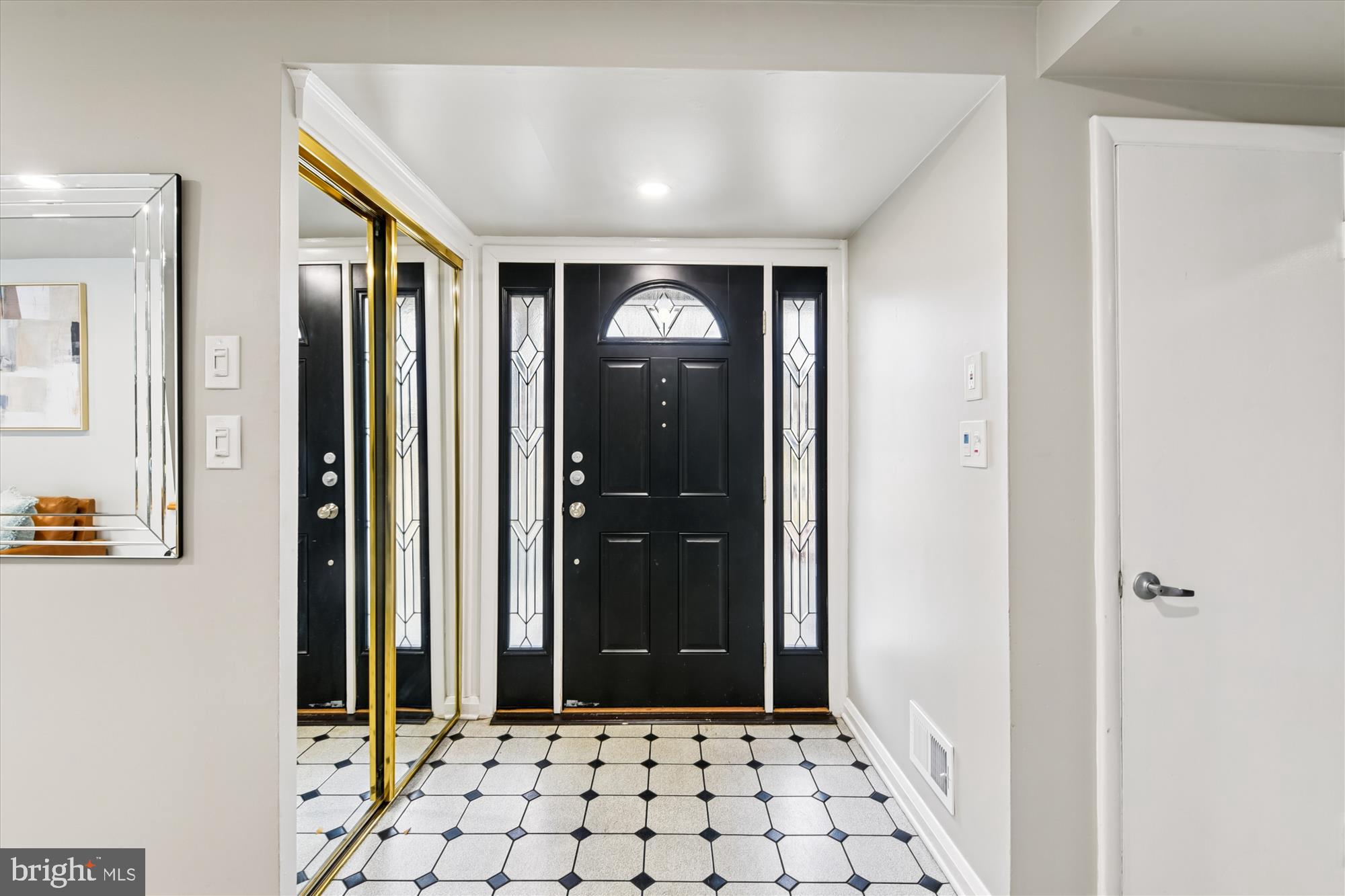 3309 Olympia Avenue Baltimore, MD 21215 - Photo 4 of 41 a view of a hallway with wooden floor and windows