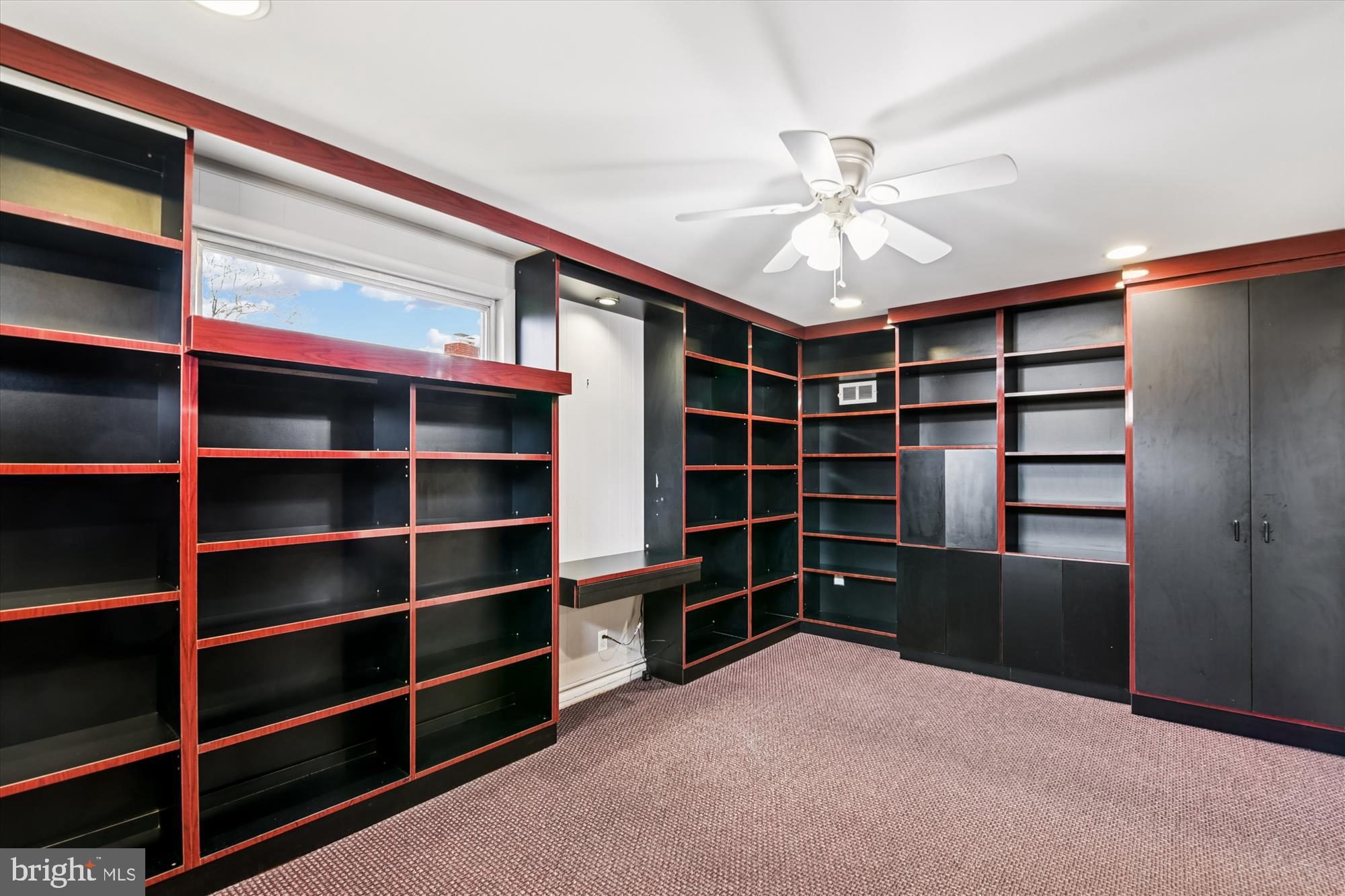 3309 Olympia Avenue Baltimore, MD 21215 - Photo 10 of 41 a view of an empty room with a empty space cabinets with a window