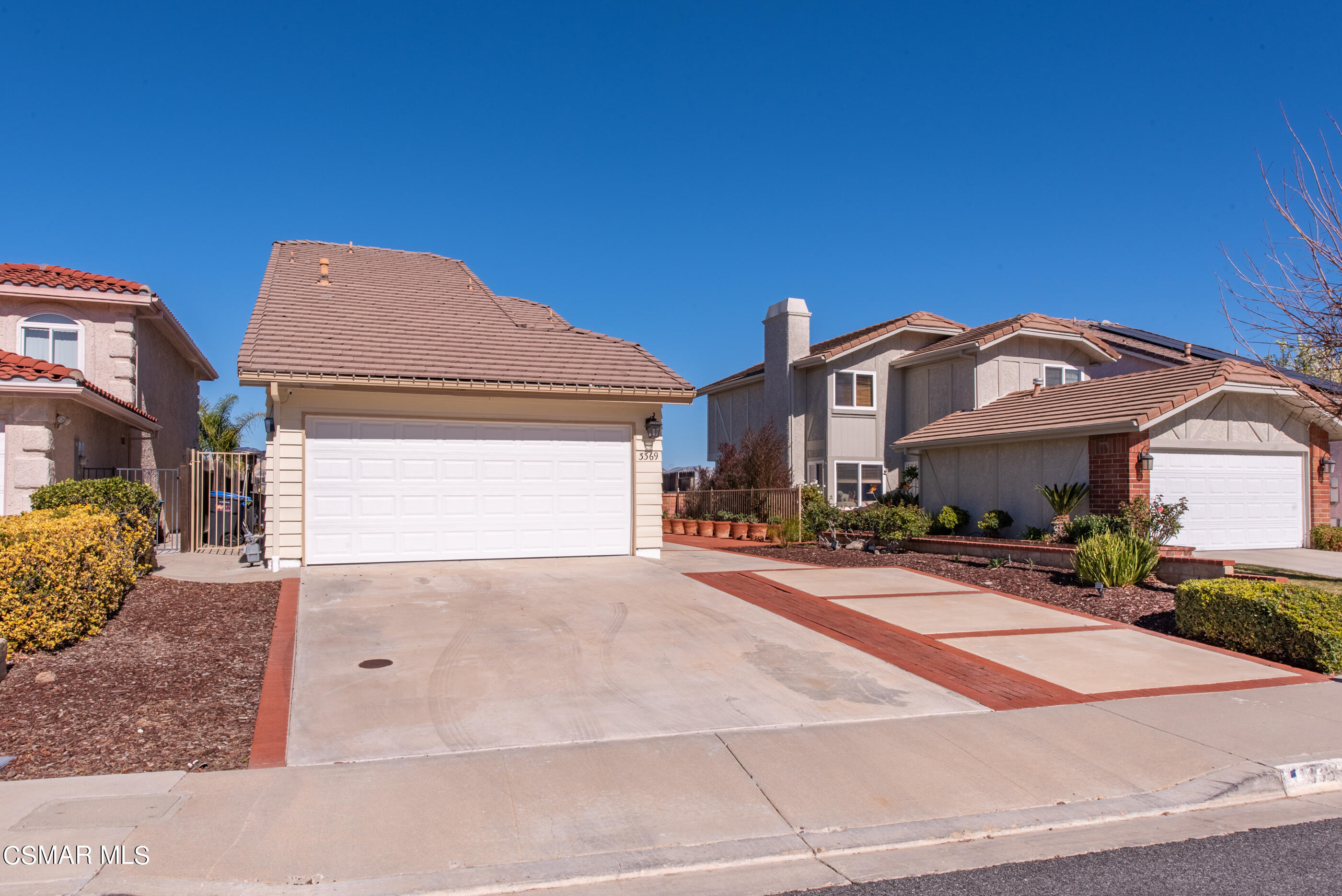 3369 Manorgate Place Simi Valley, CA 93065 - Photo 2 of 29 a front view of a house with a yard