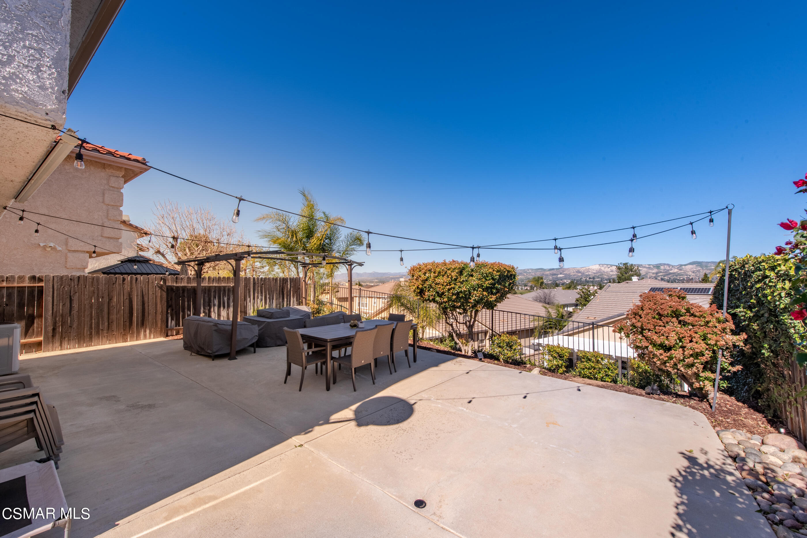 3369 Manorgate Place Simi Valley, CA 93065 - Photo 23 of 29 a view of a patio with table and chairs potted plants