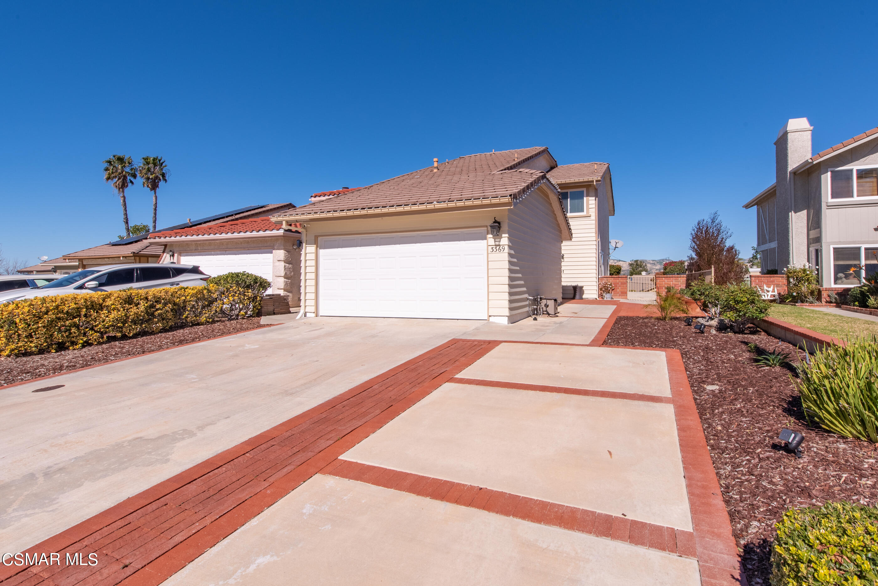 3369 Manorgate Place Simi Valley, CA 93065 - Photo 3 of 29 a front view of a house with a yard