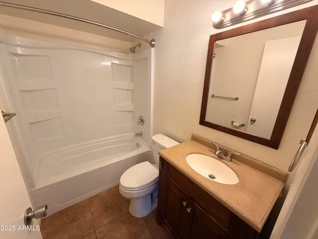 a bathroom with a sink toilet a mirror and shower