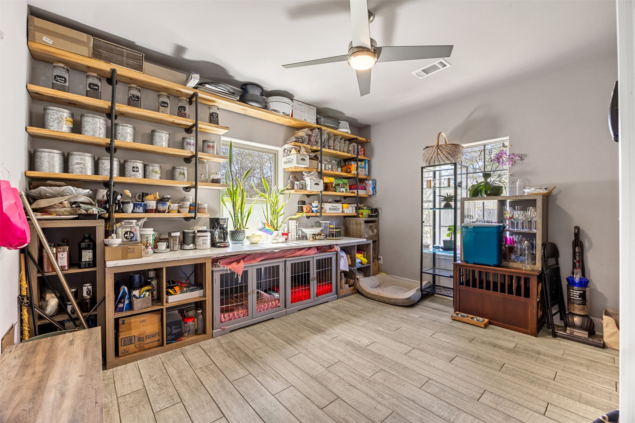 4425 Fuqua Street Houston, TX 77047 - Photo 14 of 49 a living room with lots of furniture and a book shelf