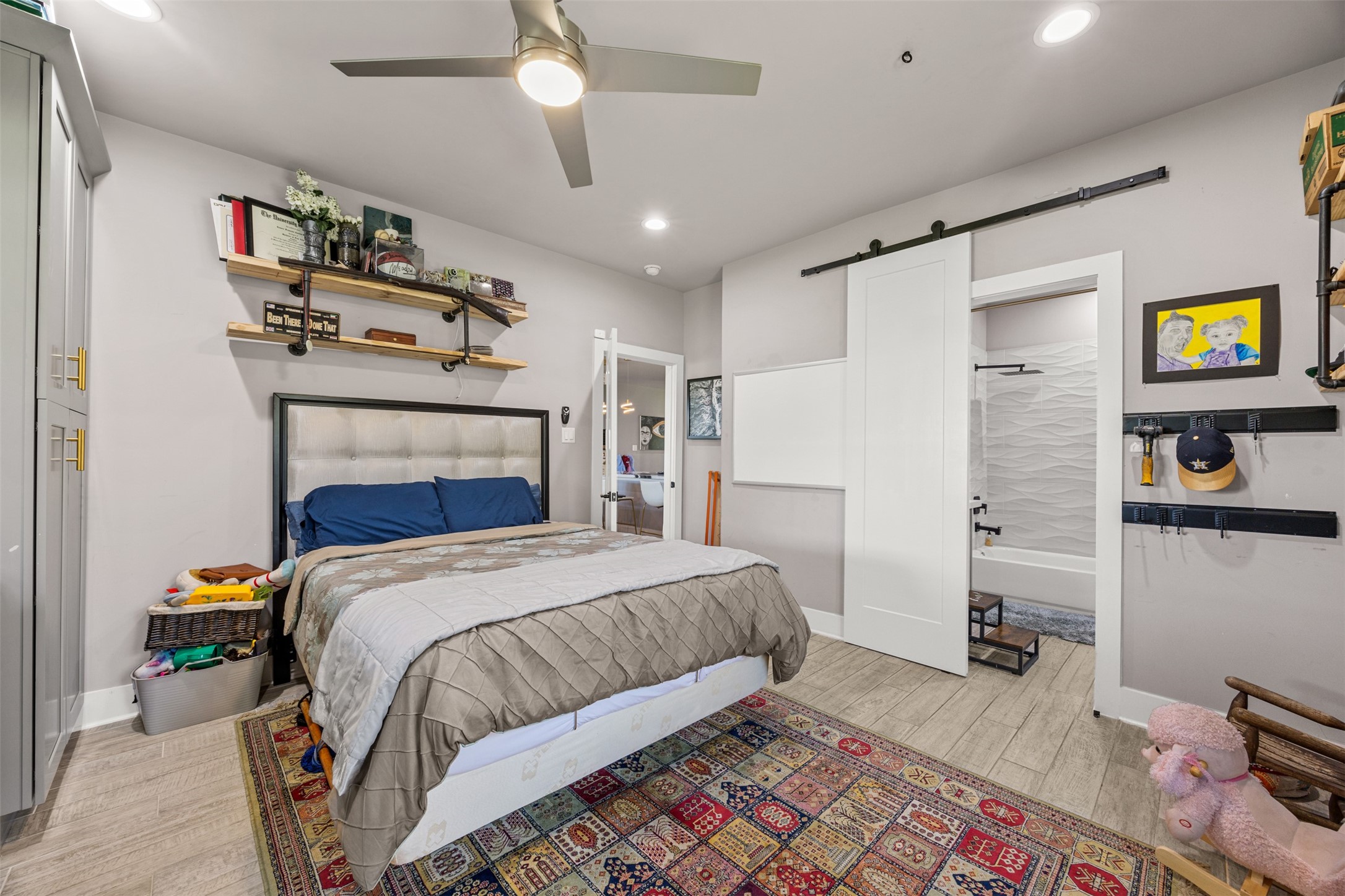 4425 Fuqua Street Houston, TX 77047 - Photo 21 of 49 a bedroom with a bed and a window