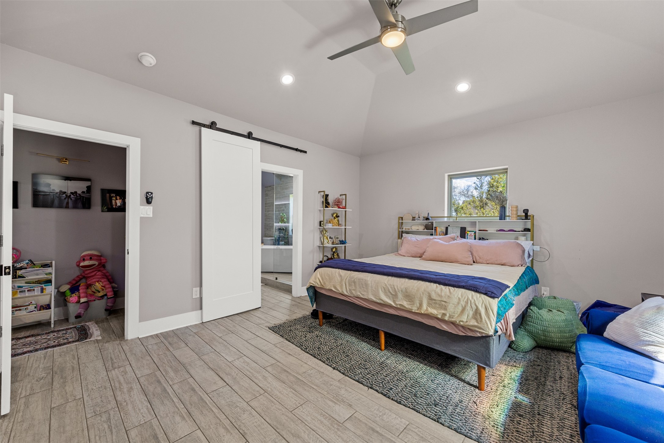 4425 Fuqua Street Houston, TX 77047 - Photo 24 of 49 a bed room with a bed and a couch