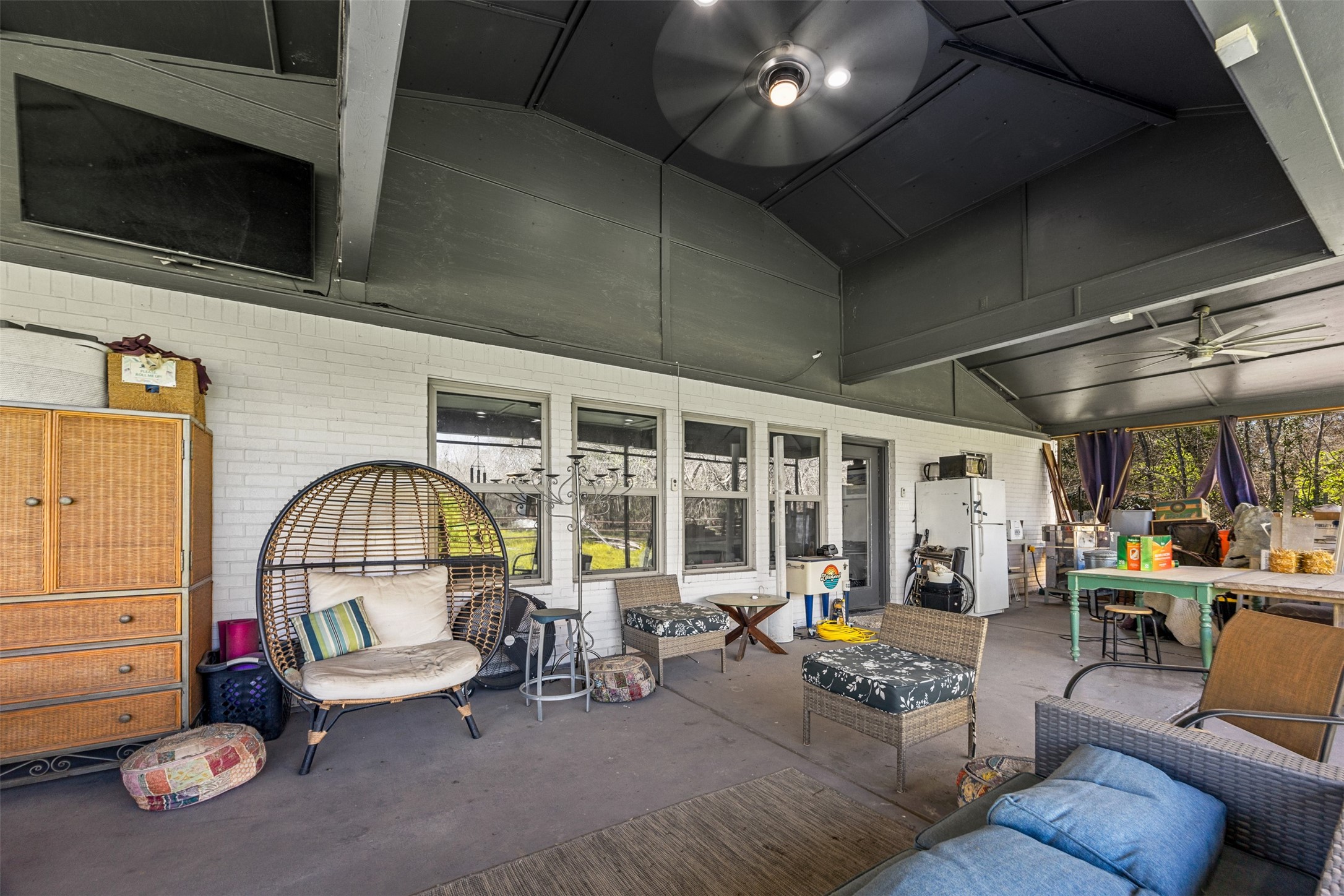 4425 Fuqua Street Houston, TX 77047 - Photo 29 of 49 a living room with furniture a flat screen tv and a window